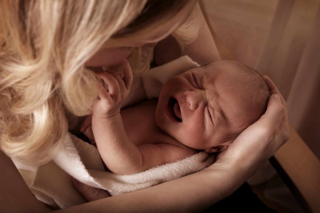 Why is my baby so squirmy while nursing