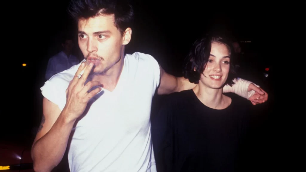 Whose name did Johnny Depp have tattooed on his arm in 1990